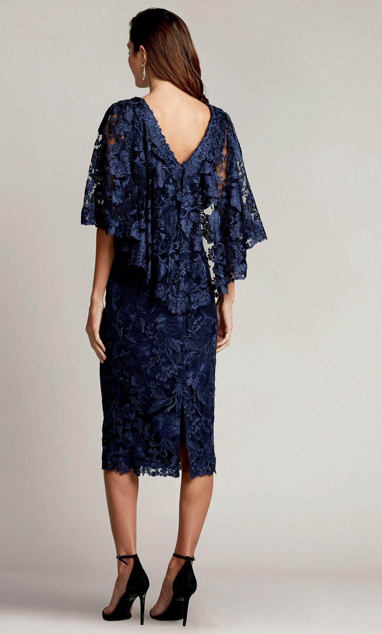 poncho cocktail dress Short cocktail dress with sequinned skirt and sheer black ruffled poncho