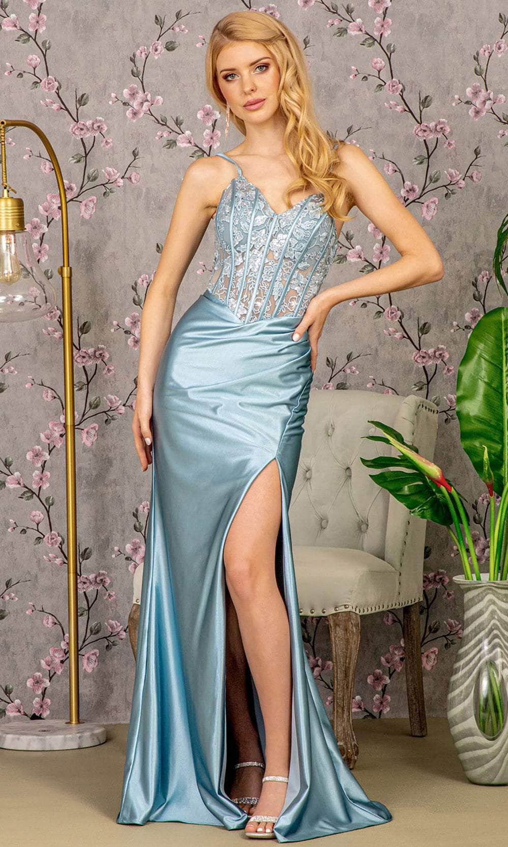 blue silver dress illusion A sheer high-neck blue column dress adorned with delicate floral illusion, sculpting the silhouette with quiet shimmer. Billowing tulle panels unfold at the back, adding a sense of drama and movement to