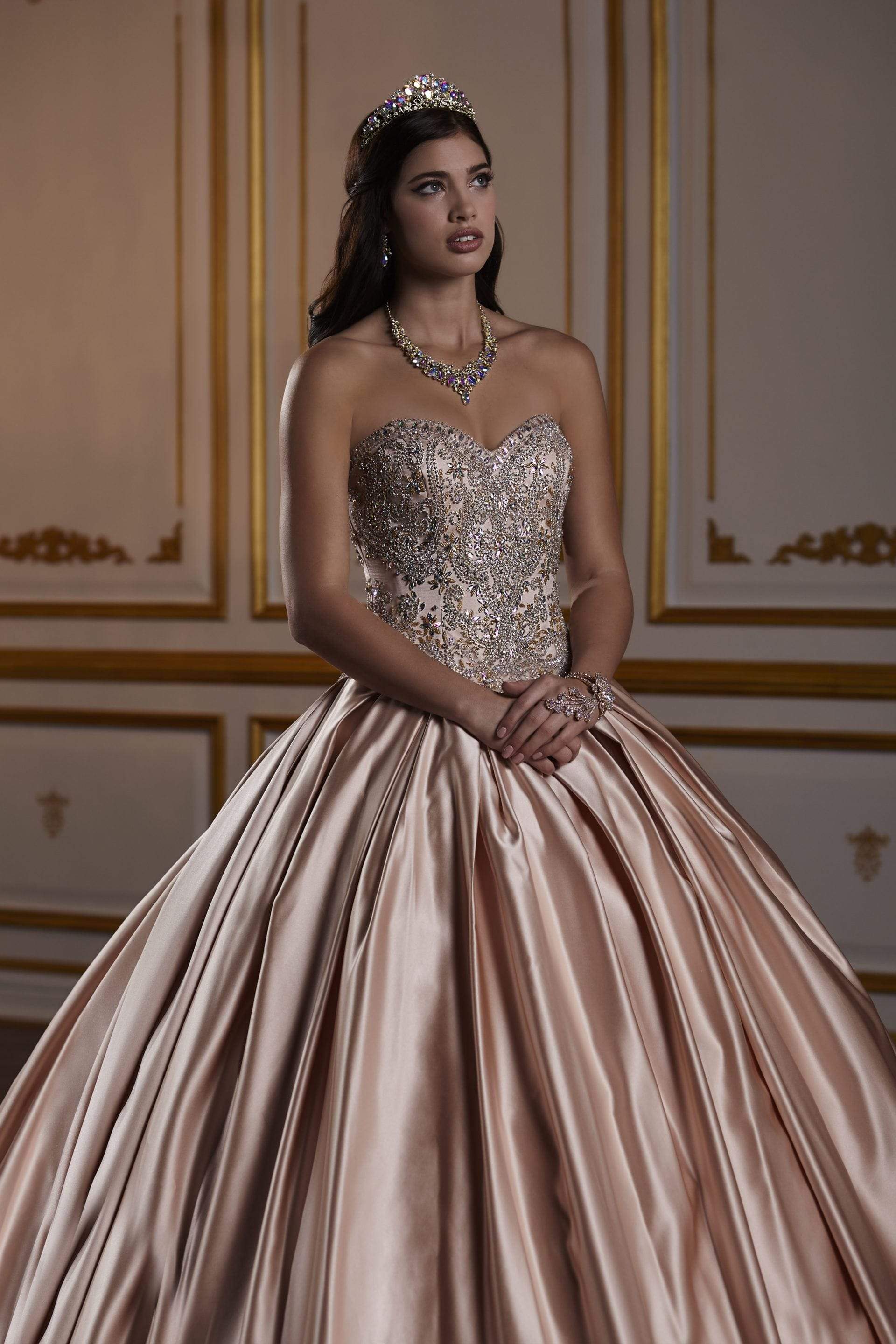 Halter neck ball gown with beaded straps and sweetheart bodice.