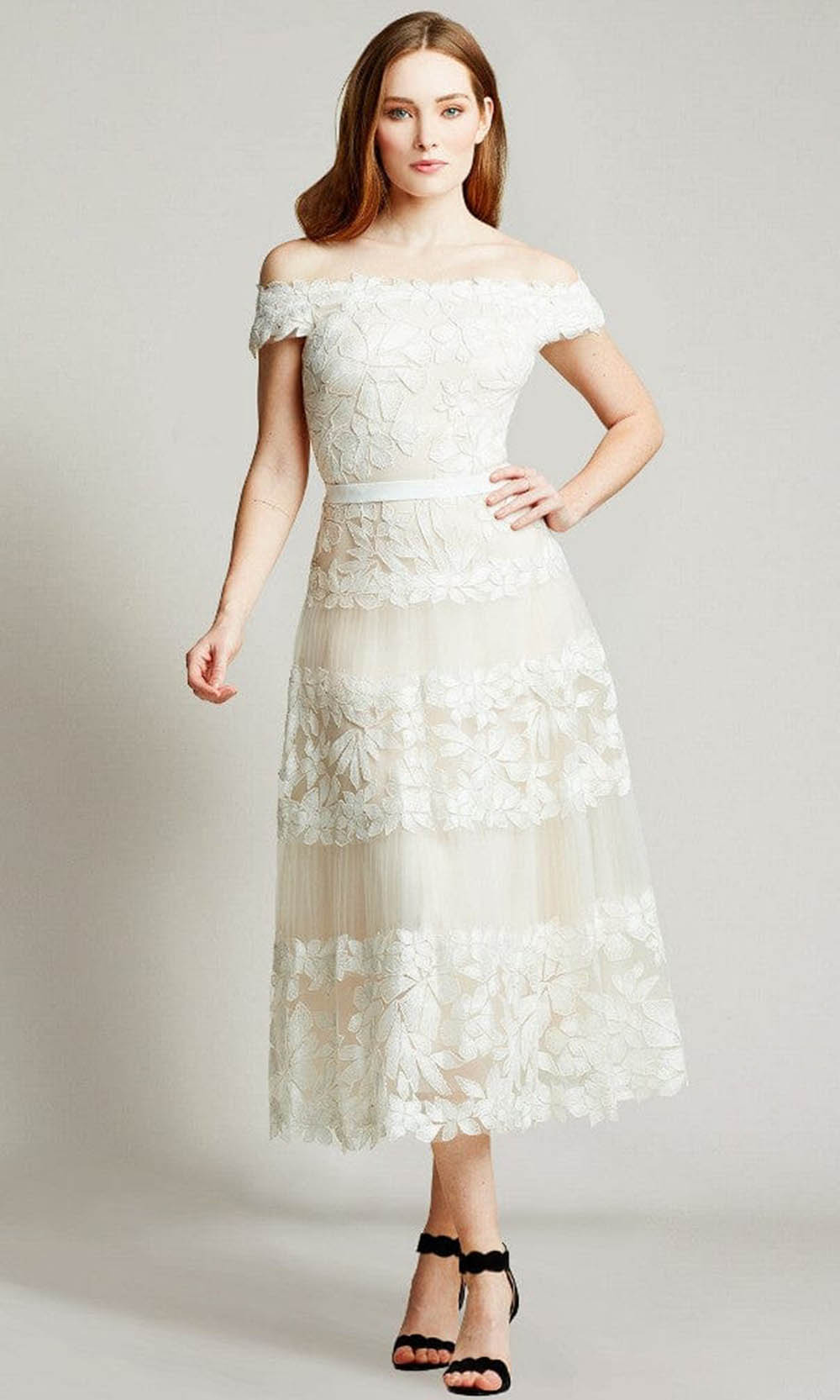 https://www.couturecandy.com/cdn/shop/products/tadashi-shoji-bla19999md-adriane-floral-embroidered-tea-length-dress-special-occasion-dress-00-ivory-petal-29800026767443.jpg?v=1643779140